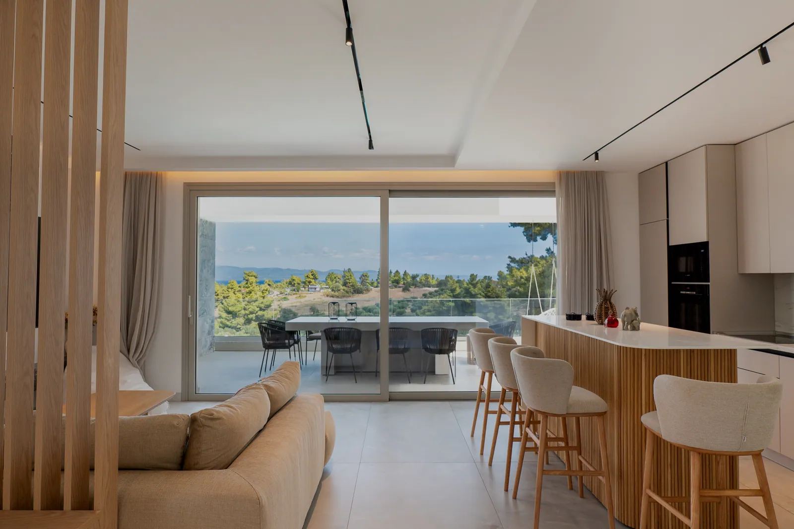 Living room opening onto the terrace and the view